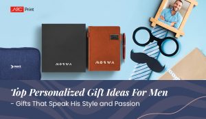 Promotional flat lay of personalized gifts for men, featuring notebooks, a pouch, and a framed photo with novelty items. Text: 