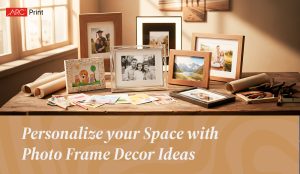 Assorted photo frames displayed on a wooden table with family portraits, landscape photos, and kids’ artwork, surrounded by craft tools and rolled papers, with the text 'Personalize your Space with Photo Frame Decor Ideas' below.
